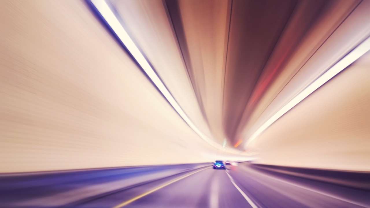 Motion blur of a car entering a tunnel